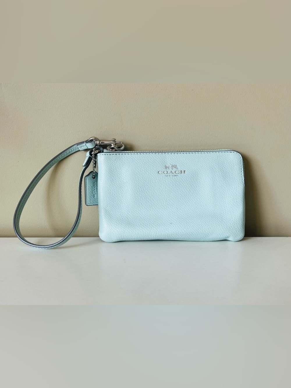 Coach corner zip wristlet in sage green pebbled leather